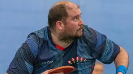 Chris Doran looks up at a ball as he serves.